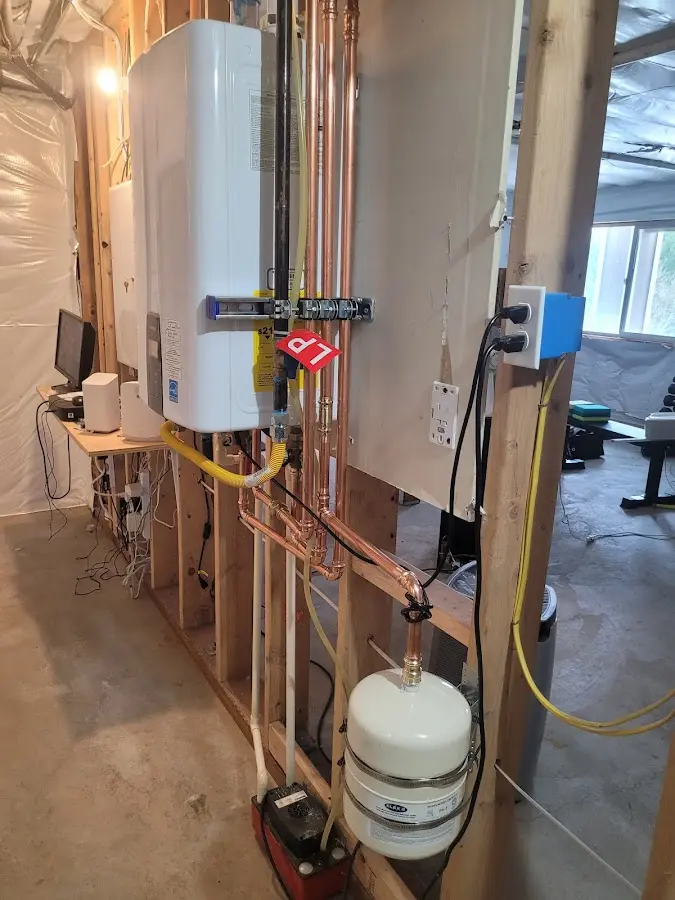 Licensed plumber repairing a kitchen sink in Harper Woods